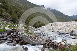 Old bridge over mountain river