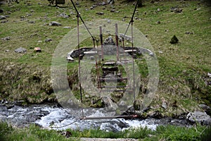 Old bridge over mountain river