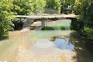 Old bridge over mountain river