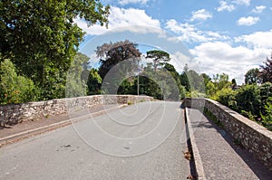 The old bridge over the river arrow in Pembridge, England.