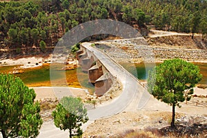 Old bridge and red river, acid mine drainage.