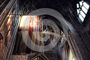 Old Britain flag inside gothic style cathedral