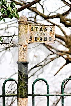 An Old British A Lone Cab Stand Isolated and Hemmed In by Woodland and Wrought Iron Fencing. Signs of Times Gone By