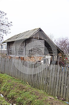 Old and broken barn used for depositing supplies 