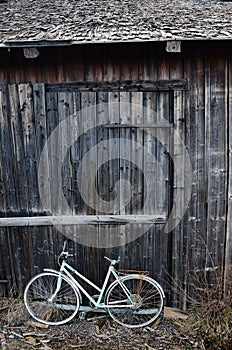 Old broken bicycle at an village barn