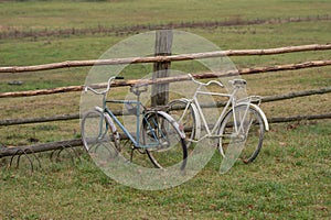 old broken bikes parked by the field