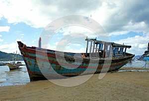 Old broken boat on the coast.