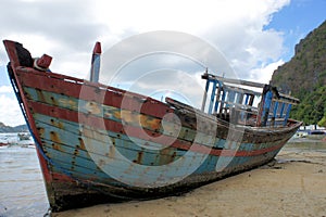 Old broken boat on the coast.