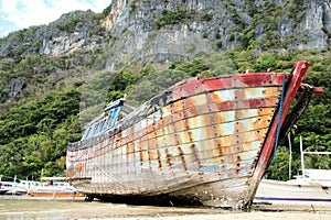 Old broken boat on the coast.