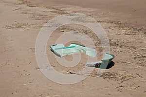 Old broken boat lying on the shore of the Bay