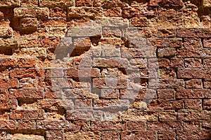 Old broken brick wall texture background, sunlight