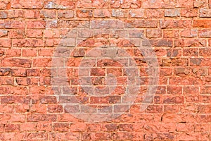 Old broken brickwork of red brick