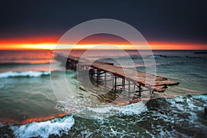 Old broken bridge in the sea, long exposure