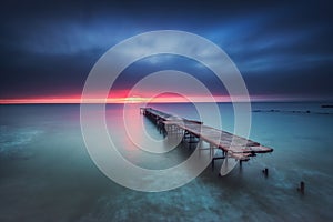 Old broken bridge in the sea, long exposure