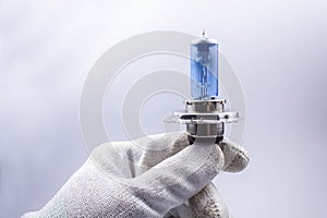 Old, broken, car bulb, H4, blue, broken in the hand
