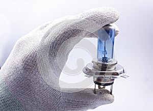 Old, broken, car bulb, H4, blue, broken in the hand