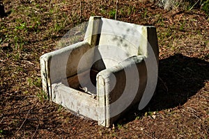 Old broken chair outdoor in rural yard