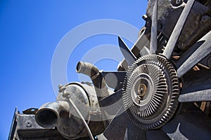 Old broken and dirty car engine with ventilator