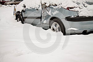 Old broken-down car in the snow