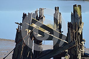 Old, broken down pier in the river usk, newport, gwent UK