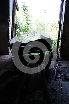 Old broken dray in abandoned stable