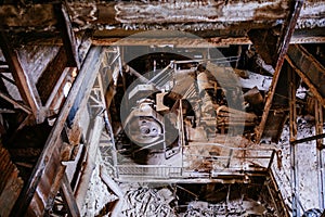 Old broken empty abandoned factory with rusty machines photo