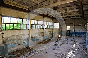 Old broken empty abandoned industrial building interior