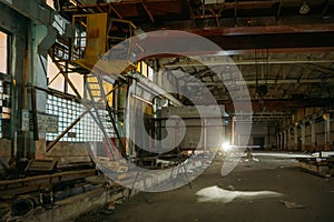 Old broken empty abandoned industrial building interior at night