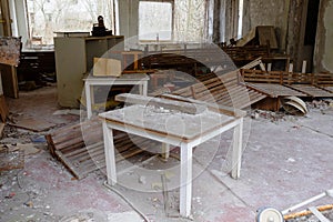 Old broken furniture in an abandoned building in Pripyat. A room in an abandoned kindergarten in the Chernobyl exclusion zone