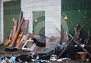 Old broken furniture, old TVs at the garbage dump near the electrical building