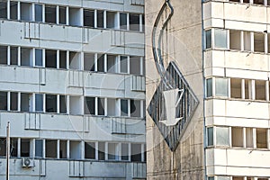 Old broken GDR neon sign on the facade in Berlin