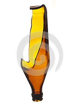 Old broken glass beer bottle of brown color isolated on a white background