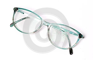 Old broken glasses isolated on white background