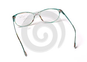 Old broken glasses isolated on white background