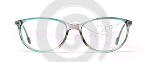 Old broken glasses isolated on white background