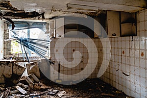 Old broken kitchen window on an abandoned old building