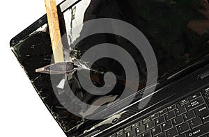 Old broken laptop isolated on white background, broken with hammer