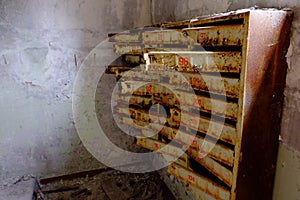 An old broken mailbox in an apartment building