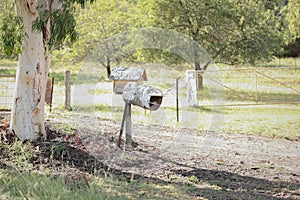 Old broken mailbox in a rural field