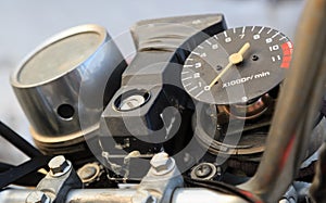 Old broken motorbike speed meter closeup detail view