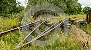 An old and broken overgrown railway