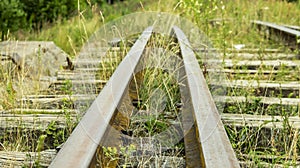 An old and broken overgrown railway