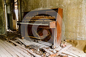 Old broken piano in abandoned apartment at the ghost town Pripyat. Chernobyl exclusion zone