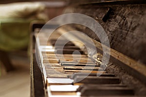 The old broken piano in the wooden house