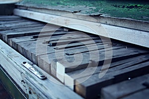 Old broken piano. Wooden keys. Crackling paint.