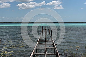 Old broken pier at the lagoon of Bacalar, Quintana Roo, Mexico