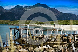 Old broken pier with misc stuff landscape background photo