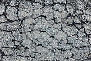 old broken road with cracked asphalt