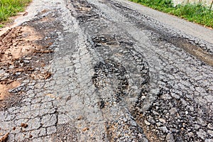 old broken road with cracked asphalt