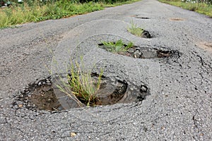 old broken road with cracked asphalt